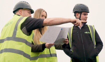 Close-up of Exubia staff wearing high-visibility clothing during a planting installation.