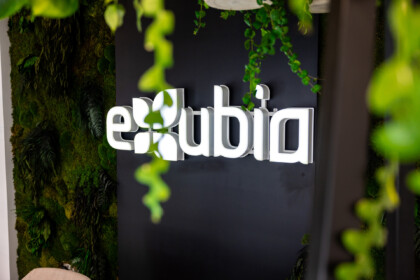 Close-up of the Exubia wall logo within the London showroom.