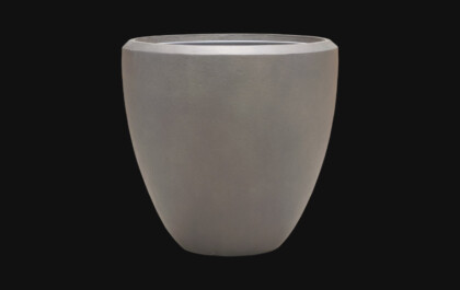 Grey Chop planter featured within a contemporary interior planting display.